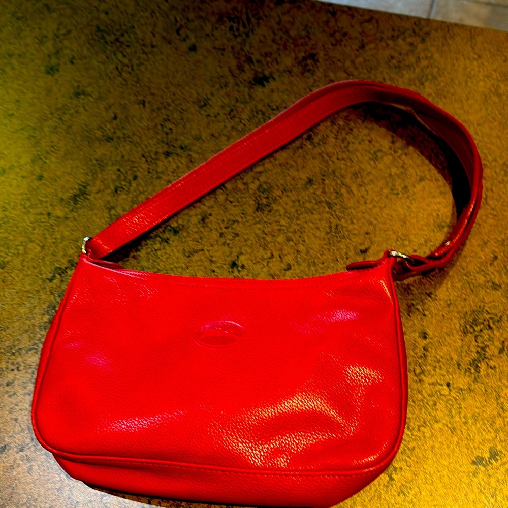 Longchamp small red purse 11” wide 6” tall. Pebbled leather. Used